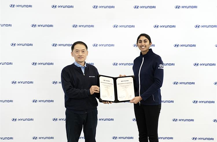 SS Kim, MD and CEO, Hyundai Motor India and Aditi Ashok display the MoU.