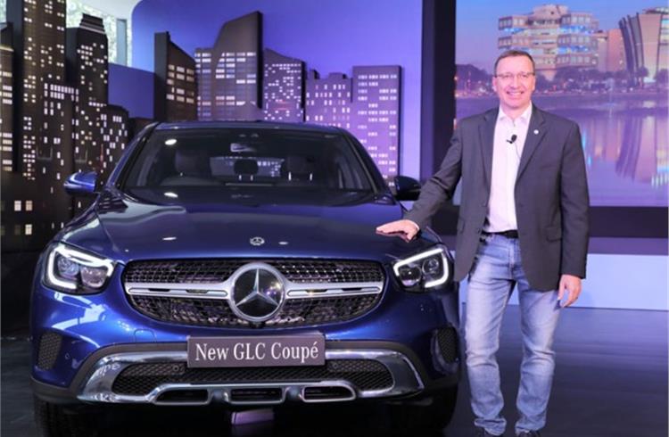 Martin Schwenk, Managing Director and CEO, Mercedes-Benz India with the New GLC Coupe launched today in Bangalore.