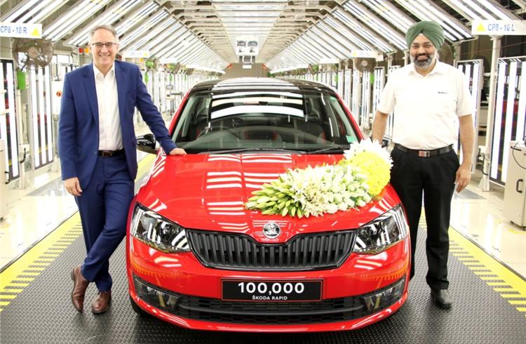Skoda Auto India employees celebrating the production of 100,000th Rapid production.