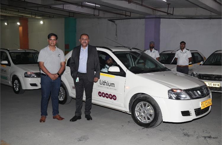 Nittan Bhalla and Vikash Mishra along with Lithium's EV fleet Car