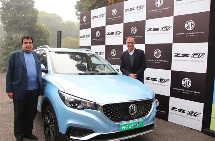 Union Minister Nitin Gadkari with Rajeev Chaba, president and managing director, MG Motor India, seen with the MG ZS EV.