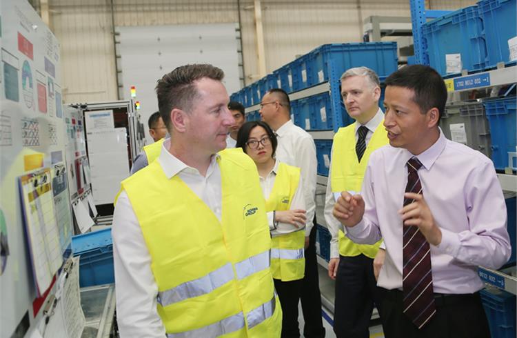Jason Yang (right, Plant Manager - Qingdao, Norma Group) gives Scott Emery (left, EVP - Purchasing China and APAC, JLR) a tour through the production facilities at the Norma Group’s Qingdao plant.