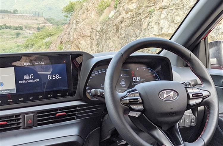 Full-digital instrument cluster with premium steering wheel add to feel-good factor.