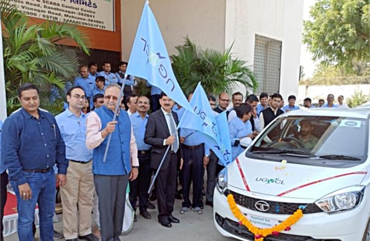 Saurabhbhai Patel, Gujarat Minister of Energy and Mahesh Singh, MD, Uttar Gujarat Vij Company flagging off the first batch of Tata Tigor EVs.