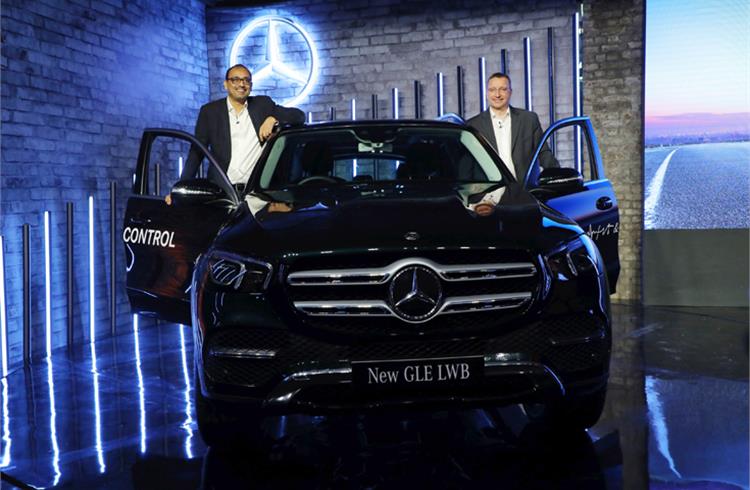 Martin Schwenk, MD and CEO and Santosh Iyer, VP (Sales & Marketing), Mercedes-Benz India with the new LWB GLE at the launch in Delhi.