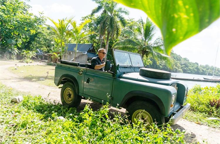 Daniel Craig at the wheel of the 3. James Bond in his Land Rover Series III in verdant Jamaica.
