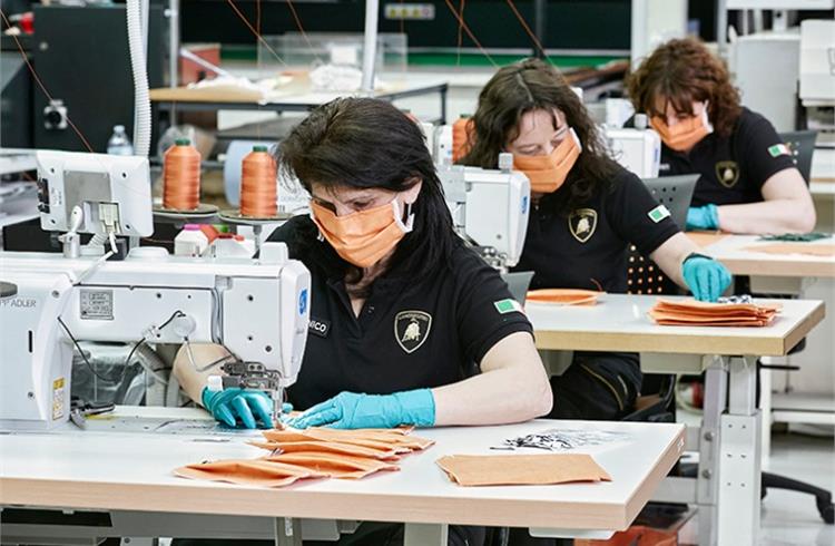Lamborghini upholstery workers producing surgical masks for the Sant’Orsola-Malpighi Hospital in Bologna to be used in the fight against the COVID-19 pandemic.