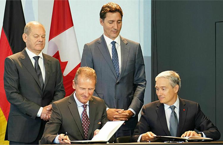 Volkswagen CEO Dr. Herbert Diess, and Canadian minister Francois-Philippe Champagne (foreground), German Federal Chancellor Olaf Scholz and Canada's Prime Minister Justin Trudeau.