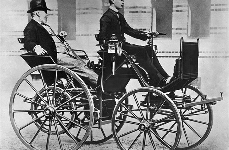Gottlieb Daimler (17 March 1834 to 6 March 1900) enjoying a ride in the back seat of his 'Motor Carriage', driven by his son Adolf (1871-1913).