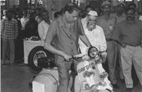 Rahul Bajaj checks out a Chetak scooter, which rolled out in 1972 and was phased out 33 years later only to be reborn as an electric scooter in 2019.