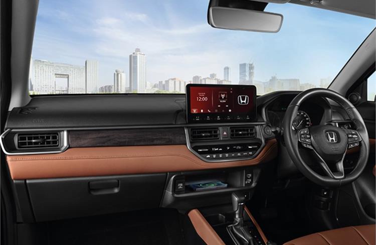 Soft-touch materials and faux-wood finishing on the dashboard which is contemporary in design.