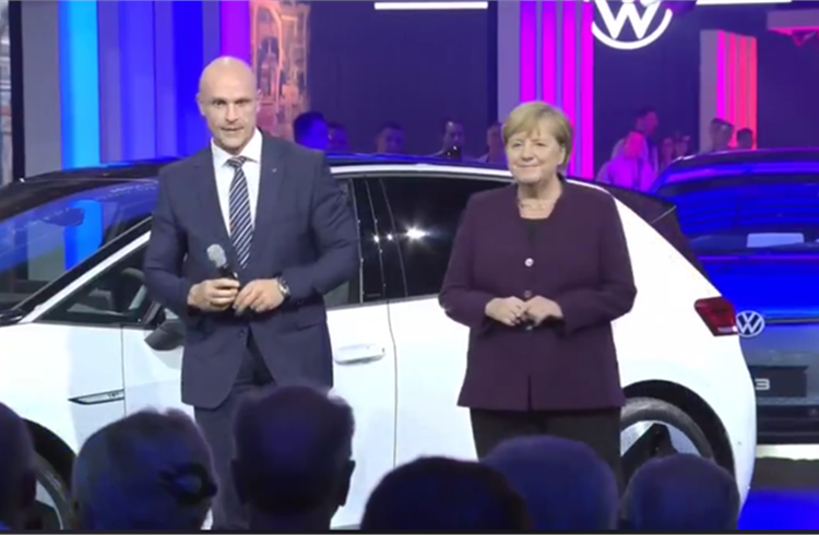 Dr Herbert Diess, chairman of the board of management, Volkswagen Group, with Chancellor Dr. Angela Merkel at the rollout of the first ID.3 from the Zwickau plant.