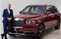 Rolls-Royce CEO Torsten Müller-Ötvös with the brand's first SUV, the Cullinan