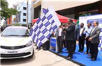 Shailesh Chandra, president, electric mobility business and corporate strategy, Tata Motors flagging off the first batch of Tigor EVs from from Janani Tours at Prerana Motors, HSR Layout, Bangalore.