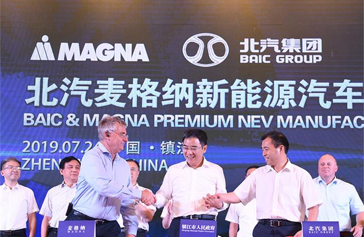 Magna, BAIC Group and the Zhenjiang government sign the framework agreement for their electric vehicle manufacturing JV.