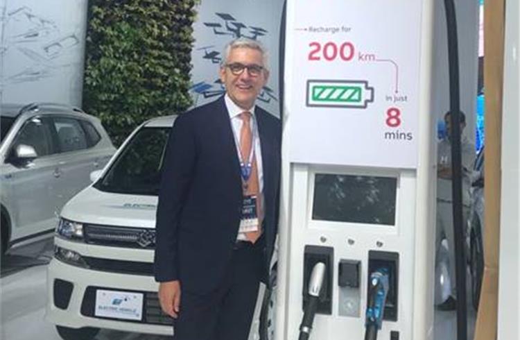 ABB's CEO Ulrich Spiesshofer with the Terra HP fast-charger that takes a scant 8 minutes to power an electric car for 200 kilometres.