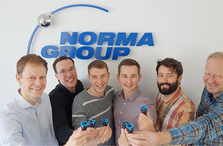 The team took the first place in NORMA Group’s Innovation Excellence Award with an e-mobility innovation. (Photo taken at the beginning of 2020, before social distancing)