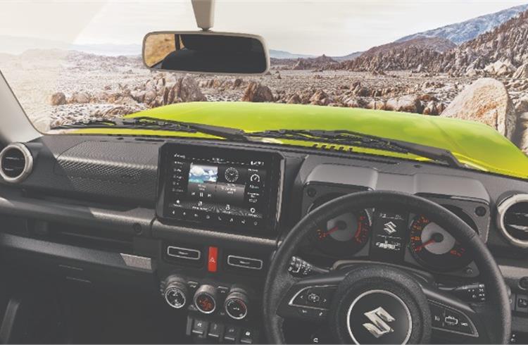 The Jimny dashboard has an all-black theme with a high-mounted 9.0-inch touchscreen taking centrestage.