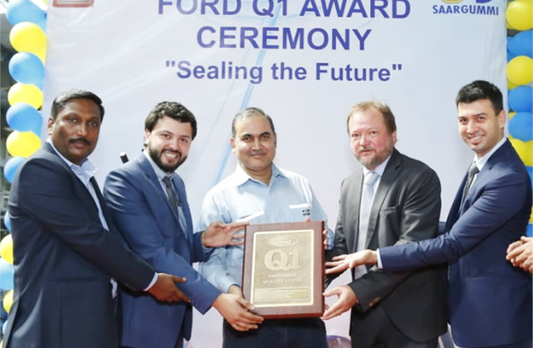 Gold Seal-SaarGummi staffers with the Ford Q1 Award presented by Dheeraj Dixit, general manager, Ford India, Sanand Plant, at the GSSG Ahmedabad plant.