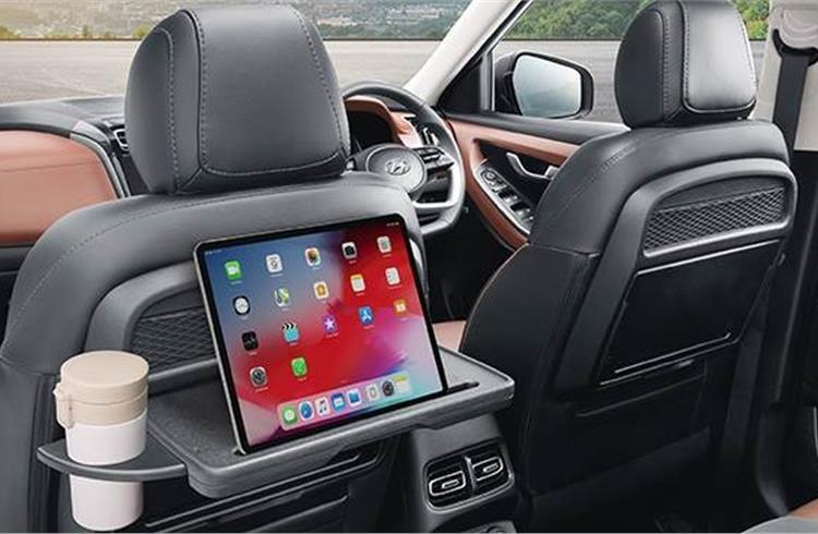 Key highlights include a 10-25-inch multi-display digital cluster, 8-speaker Bose sound system, and front row seatback table with retractable cupholder and IT device holder.