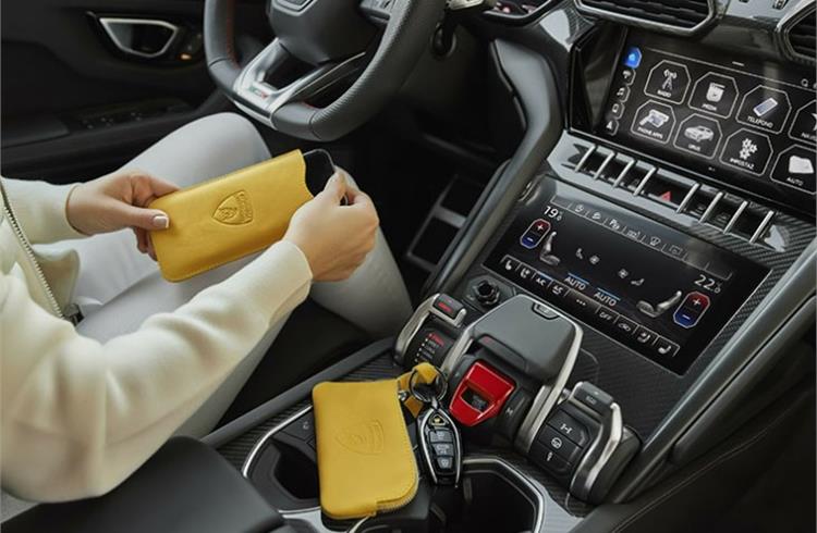 Automobili Lamborghini’s collection of ethical and sustainable leather goods: a tote bag, a smartphone case, a keychain and a credit card case.
