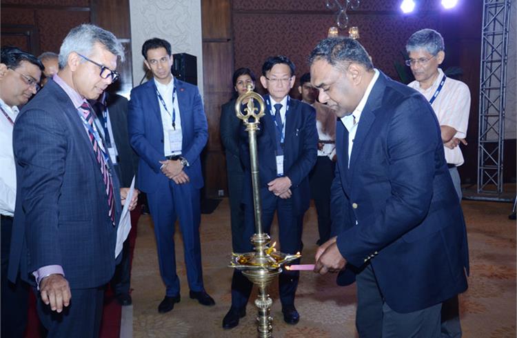 Ram Venkataramani, president, ACMA, lights the traditional lamp as Vinnie Mehta, director general, ACMA, looks on, along with other leading industry heads. 
