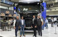 ETO Motors and Quantron management in front of the Quantron QHM FCEV 44-1000 truck at the IAA Transportation 2022 in Hanover.