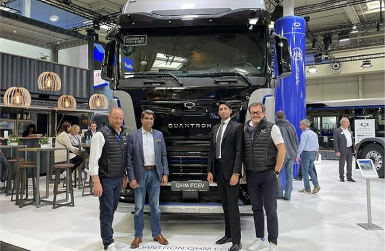 ETO Motors and Quantron management in front of the Quantron QHM FCEV 44-1000 truck at the IAA Transportation 2022 in Hanover.
