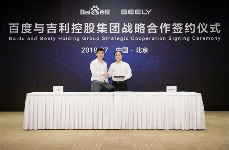 L-R: Robin Li, founder, chairman and CEO of Baidu and Li Shufu, chairman of Zhejiang Geely Holding Group (Geely Holding)