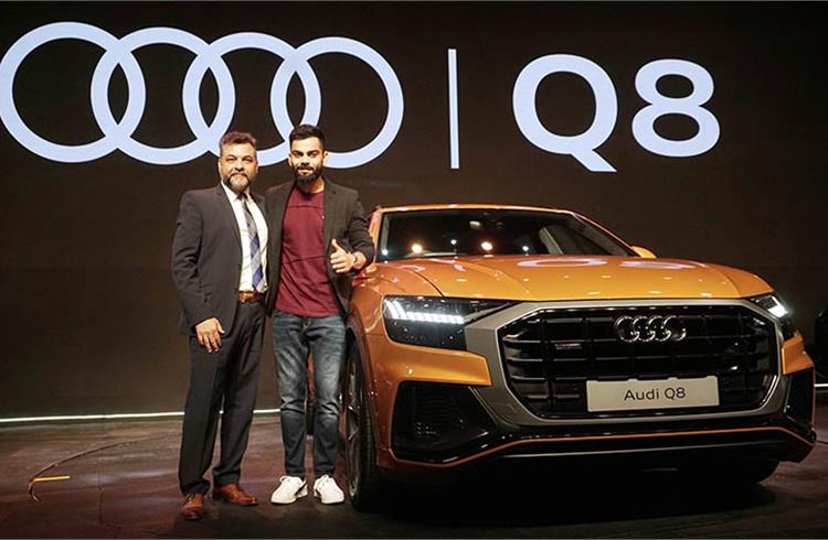 Virat Kohli and Balbir Singh Dhillon, Head of Audi India, with the Q8.
