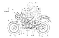 The first design shows the airbag mounted at the front of the seat, between the rider's legs.
