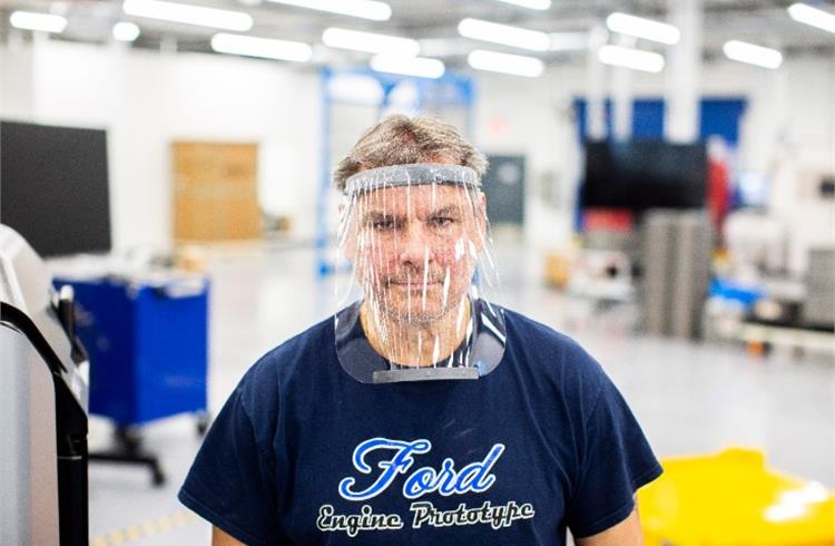 Dave Jacek wears a prototype of a 3D-printed medical face shield printed at Ford’s Advanced Manufacturing Center.