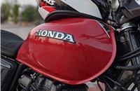 High-quality paint finishing with a stick-on Honda emblem is a classic touch. 