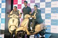 Transport minister Nitin Gadkari, Rajiv Bajaj, MD, Bajaj Auto and Amitabh Kant, CEO, NITI Aayog, with the new Bajaj Chetak EV.