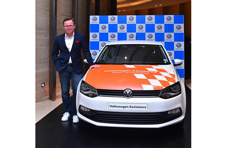 Steffen Knapp, director, Volkswagen Passenger Cars with the Volkswagen Assistance program car