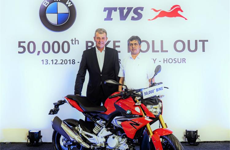 L-R: Dr Markus Schramm, Head of BMW Motorrad, and KN Radhakrishnan, director and CEO, TVS Motor Company, with the milestone machine. 
