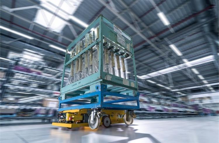 Smart Transport Robot carrying roller containers through the logistics hall at BMW Group Plant Wackersdorf.