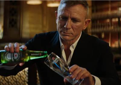 Daniel Craig likens Bond film delay to waiting for a cold Heineken in new ad