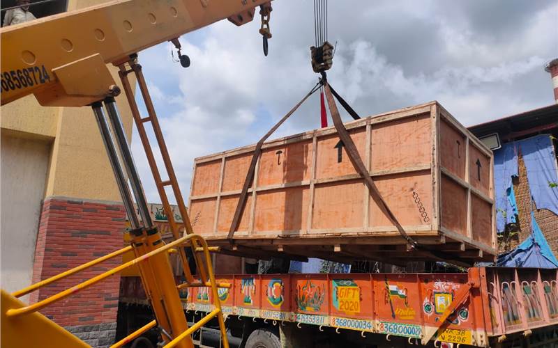 There were around three boxes in all, and each of them was lifted using the crane meticulously