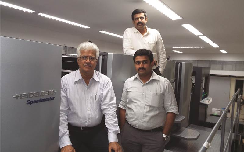 (L-R) Ratnakar Hegde, chairman of JC Graphics, with his sons Dinakar Thyagaraj and Karunakar Thyagaraj