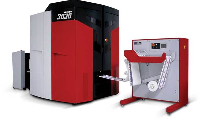Xeikon 3030 - Xeikon: The company will entice you with this: &#8216;If you are a label converter looking to foray into high quality digital production of labels, 3030 is the machine&#8217;. And, there are reasons for that. The Xeikon 3030 is the narrow web entry-level press of the Xeikon 3000 Series, the largest range of digital label press offerings available on the market today. The full rotary five-colour Xeikon 3030 has a variable web width ranging from 200 mm up to 330 mm. It runs at a top speed of 9.6 m/min and can handle production volumes of up to 190 sqmtr/hour and uses food approved dry toner technology. The company&#8217;s most famous installations are the ones at Webtech Labels and Better Labels. Also see the self-adhesive label suite, an integrated solution to print and convert self-adhesive labels, developed in collaboration with its Aura partners.

          Stall No: D25