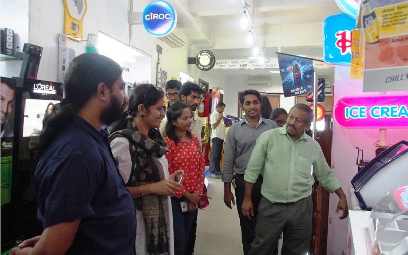 With 20+ years at Spectrum, the general manager S Rajgopal (r), heads the tech team at Spectrum. Rajgopal tours the designers through the Spectrum Bazaar browsing through the numerous POP success stories