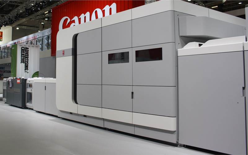 Canon’s new B3 sheetfed inkjet press, Oce VarioPrint i300 was launched at Drupa. It features Kyocera piezoelectric printheads with 600dpi resolution and DigiDot 2-bit variable drops for a ‘perceived 1,200dpi’ quality. It can print up to 300 A4 impressions per minute. Canon says it can reliably output 8,700 duplex A4s per hour on average, including cleaning and other stoppages. The i300 boasts a CMYK system with six ink channels, with two ‘spares’, and the ColorGrip uses one channel to print its priming liquid beneath the coloured ink drops