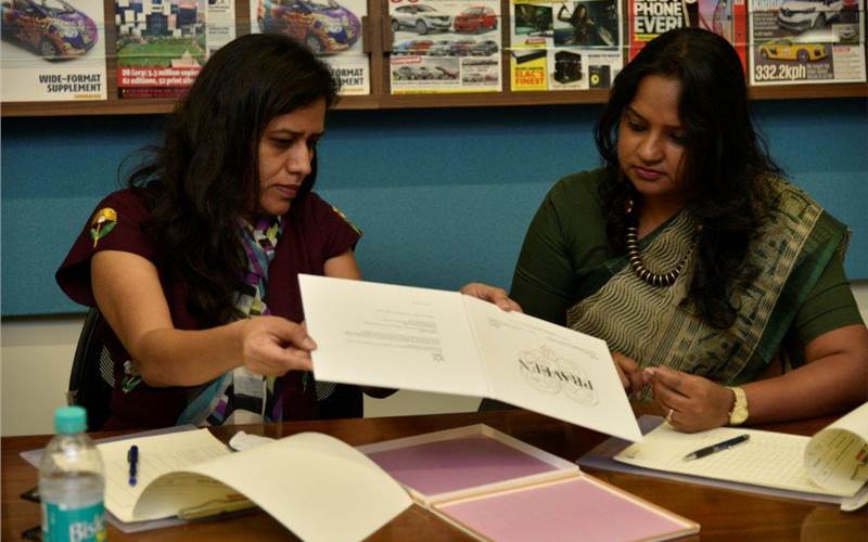(l-r) Deepti Kshirsagar of Wow Design and Rachna Mistry of Spatial Access discuss a detail of Innovative Printer of the Year sample