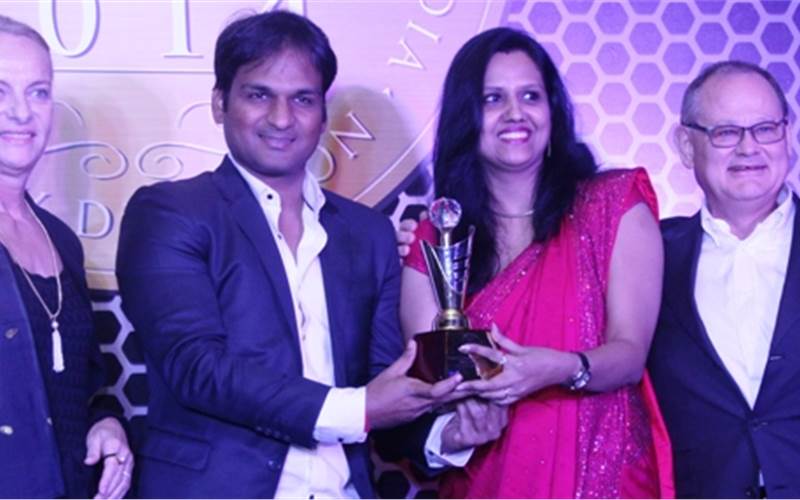 Naveen Goel and Vandana of Any Graphics receive the ???? award from the Gallus head