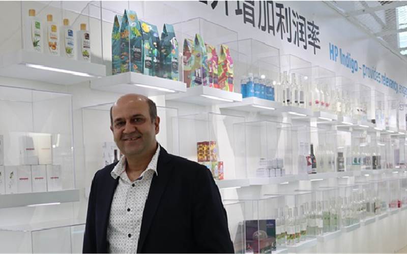 Puneet Chadha, director, market development, graphics solutions business, HP Asia Pacific and Japan, with the samples printed on HP Indigo presses. HP was present with the largest stand – 3,500 sq/mts in size and created something unique here – it carried samples from its customers and displayed them at the show. HP has 120 tonnes of kit, mostly shown at Drupa. At PrintPack India show, HP showed the florescent pink ink. Here at China Print, it added three more – florescent yellow, green and orange. The heroes of this booth are “brands”, said Chadha. “We have showcased what the customers have produced with our machines. The booth reflects three things: innovation; power, and speed of the machine.”