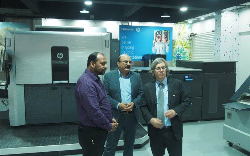 The HP Indigo 12000 stands tall in the newly inaugurated Centre of Excellence in Chennai while Alon Bar-Shany interacts with visitors