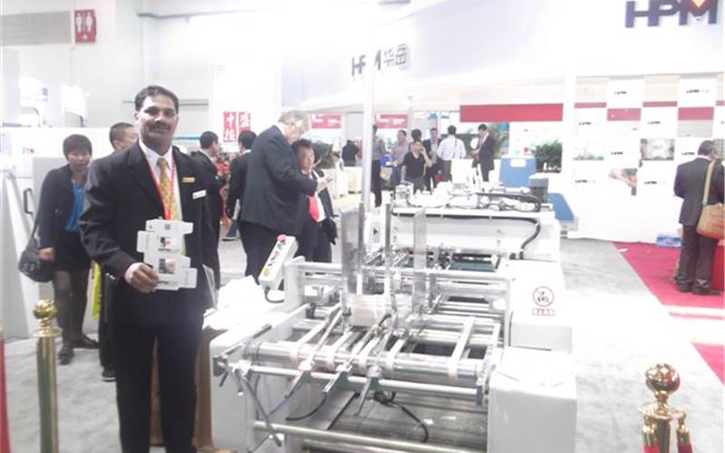 S Dayaker Reddy of Sai Enterprises with the newly launched WPM 650 window-patching machine from Huayue Packing Machinery, which is represented in India by Sai Enterprises