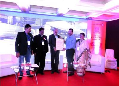 Maharashtra&#8217;s minister of industries presents lifetime honour to Gautham Pai of Manipal Group