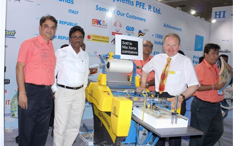 Parag Shah of Hitech (first from left) announced the sale of the newly launched Foliant machine to Chennai-based Star Xerox at the show